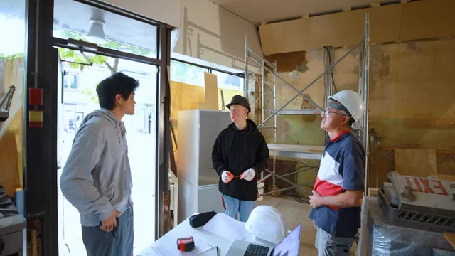 Drew and his crew discussing an electrical project on site